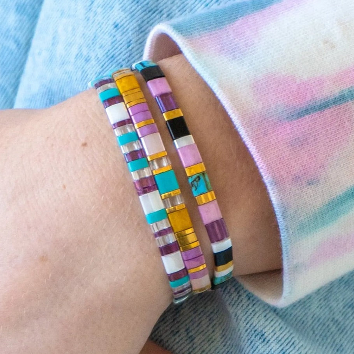 a close up of a person wearing a bracelet