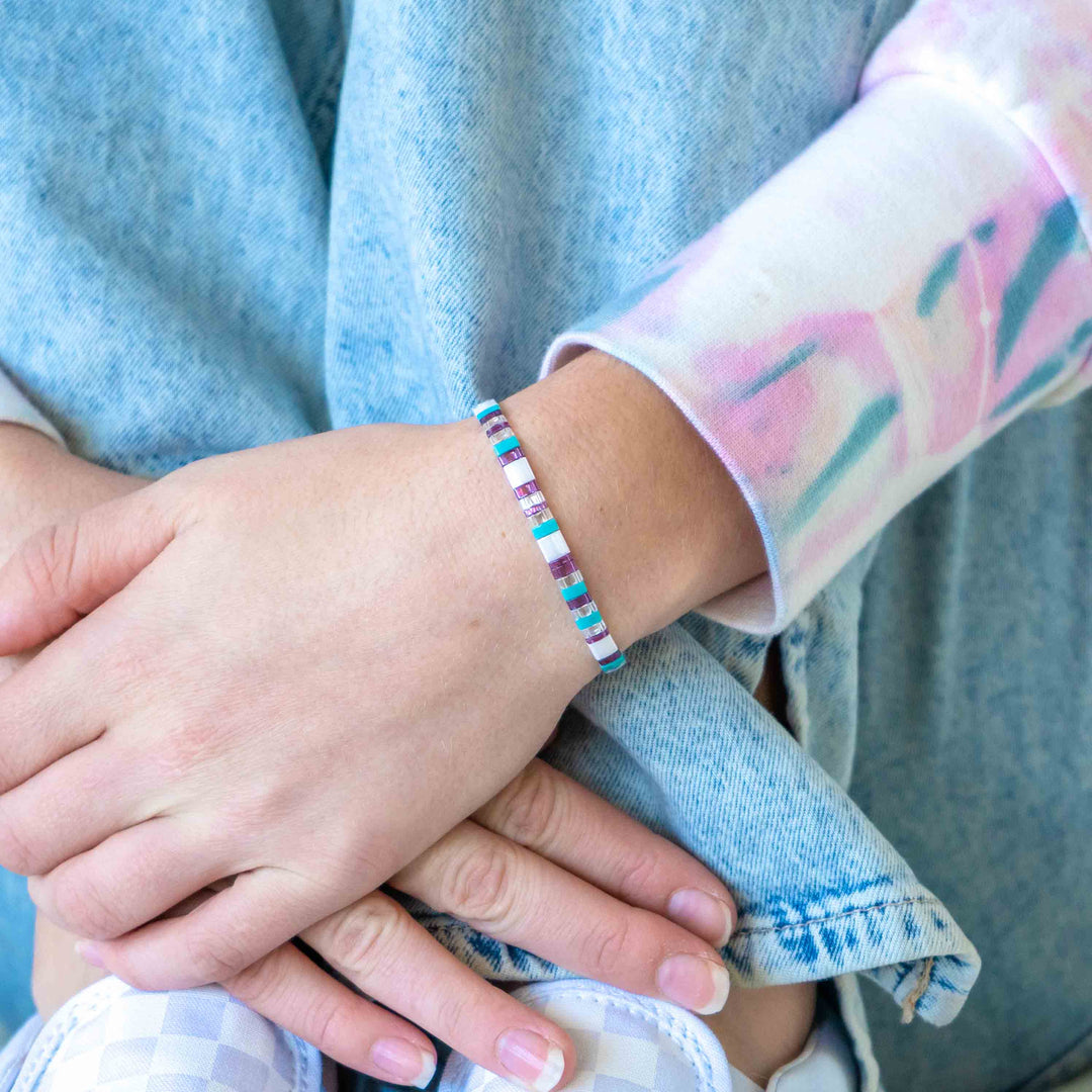 a close up of a person holding another person's hand