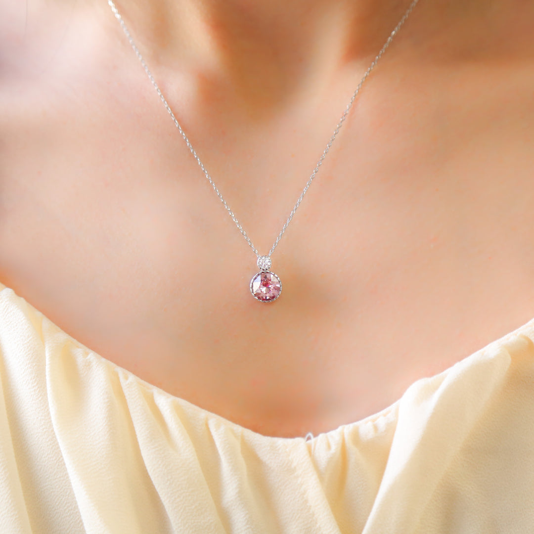 a close up of a person wearing a necklace