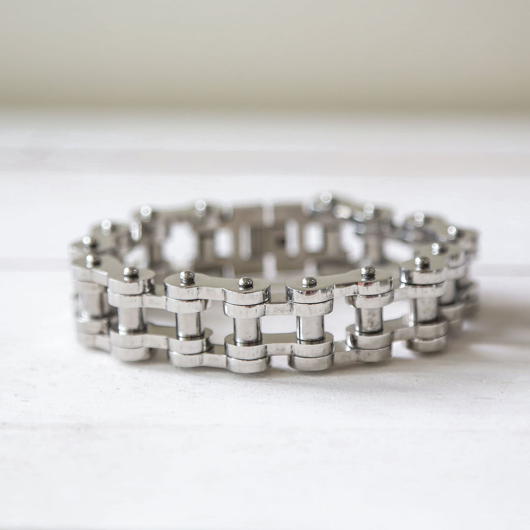 a close up of a metal bracelet on a table