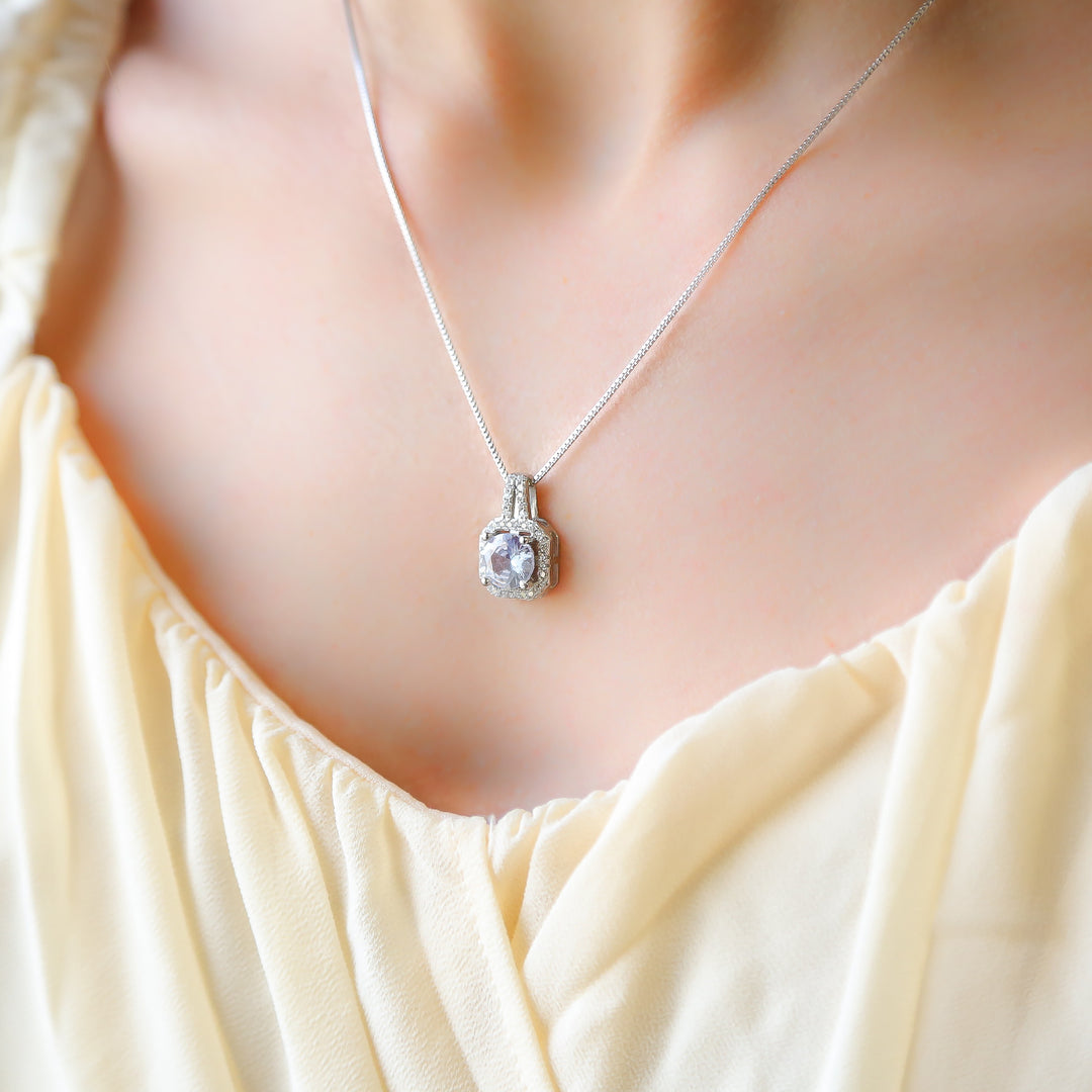 a close up of a woman wearing a necklace