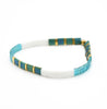 a blue and white bracelet with gold accents