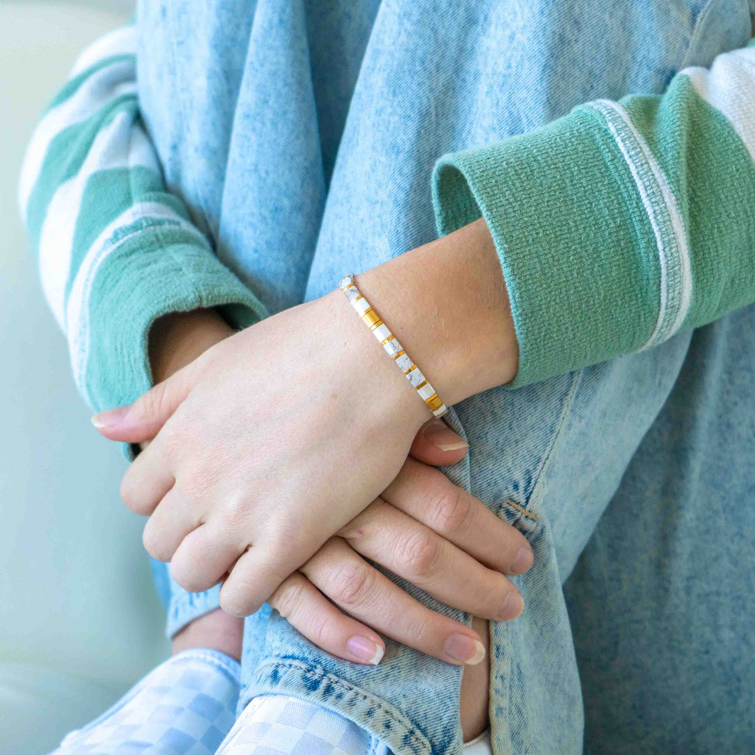 a close up of a person holding another person's hand