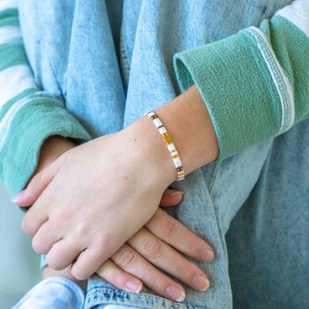 a close up of a person wearing a bracelet