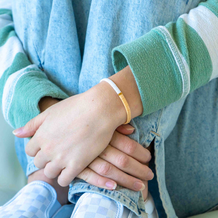 a close up of a person holding another persons hand