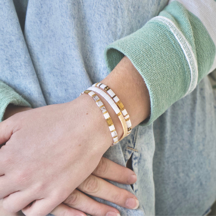 a close up of a person wearing a bracelet