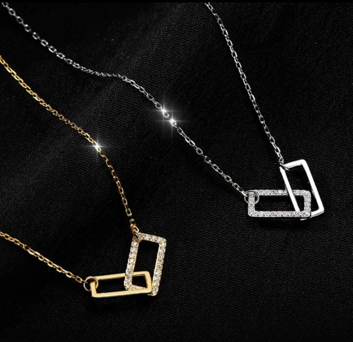 three different necklaces on a black background