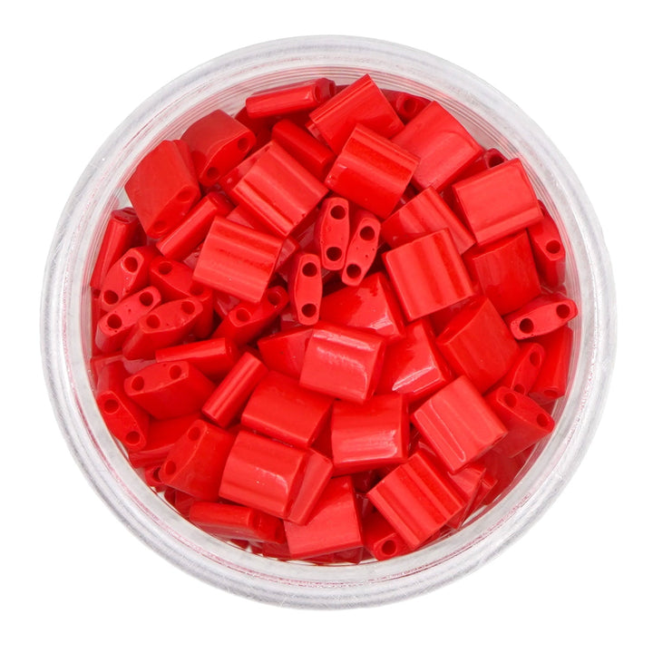 a bowl filled with red plastic beads