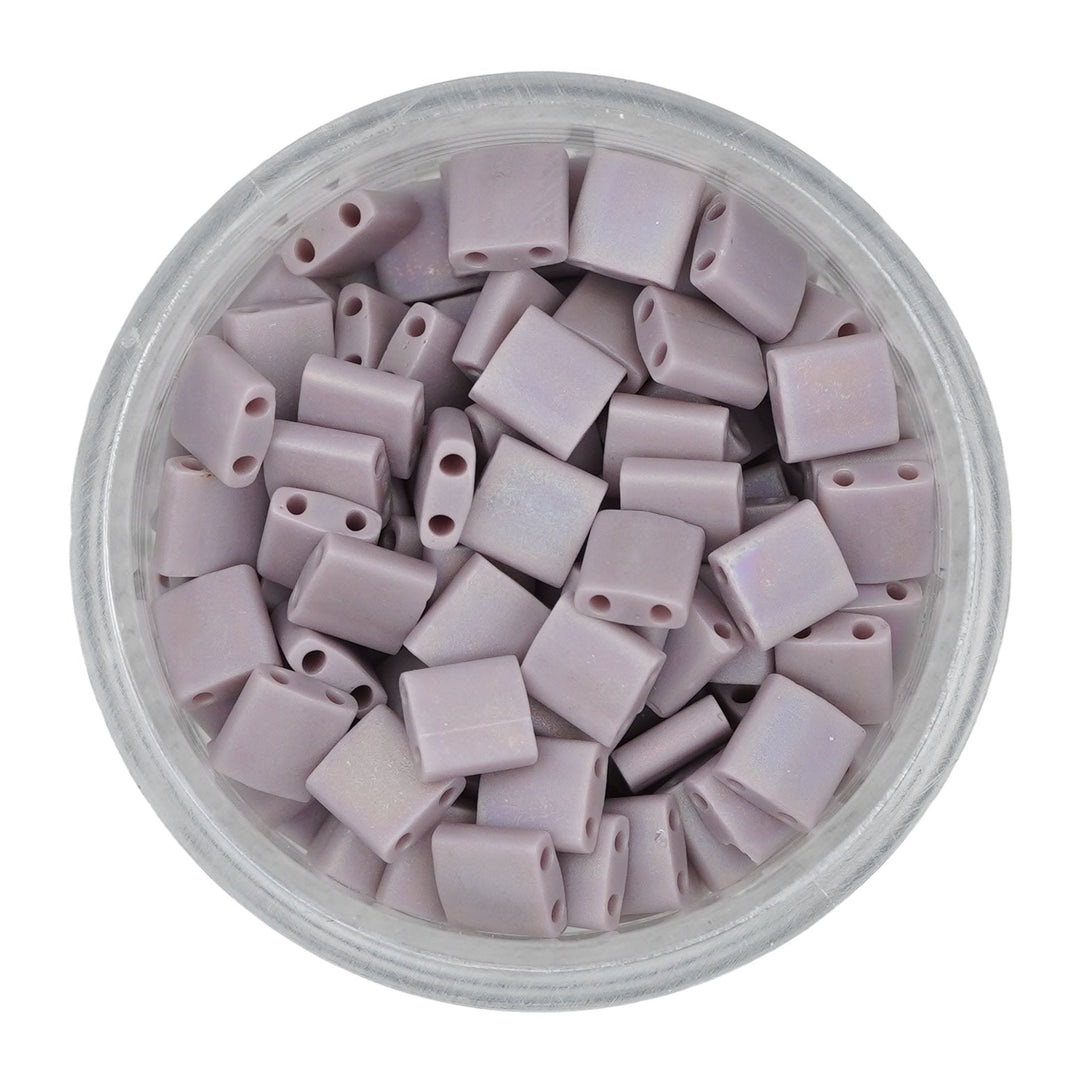 a bowl filled with purple plastic beads