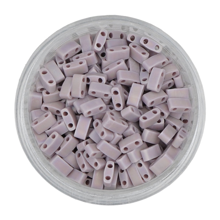 a bowl filled with grey plastic beads