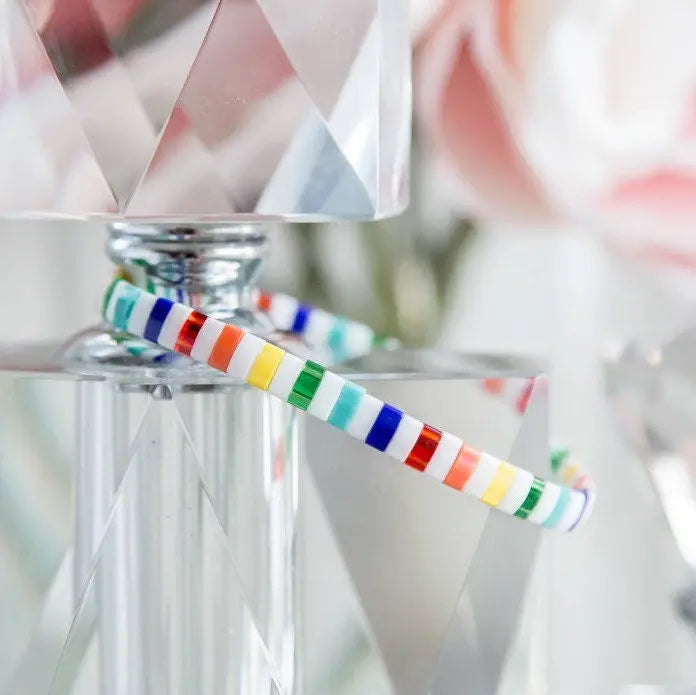 a colorful candy cane sitting on top of a table