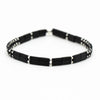 a black and white beaded bracelet on a white background