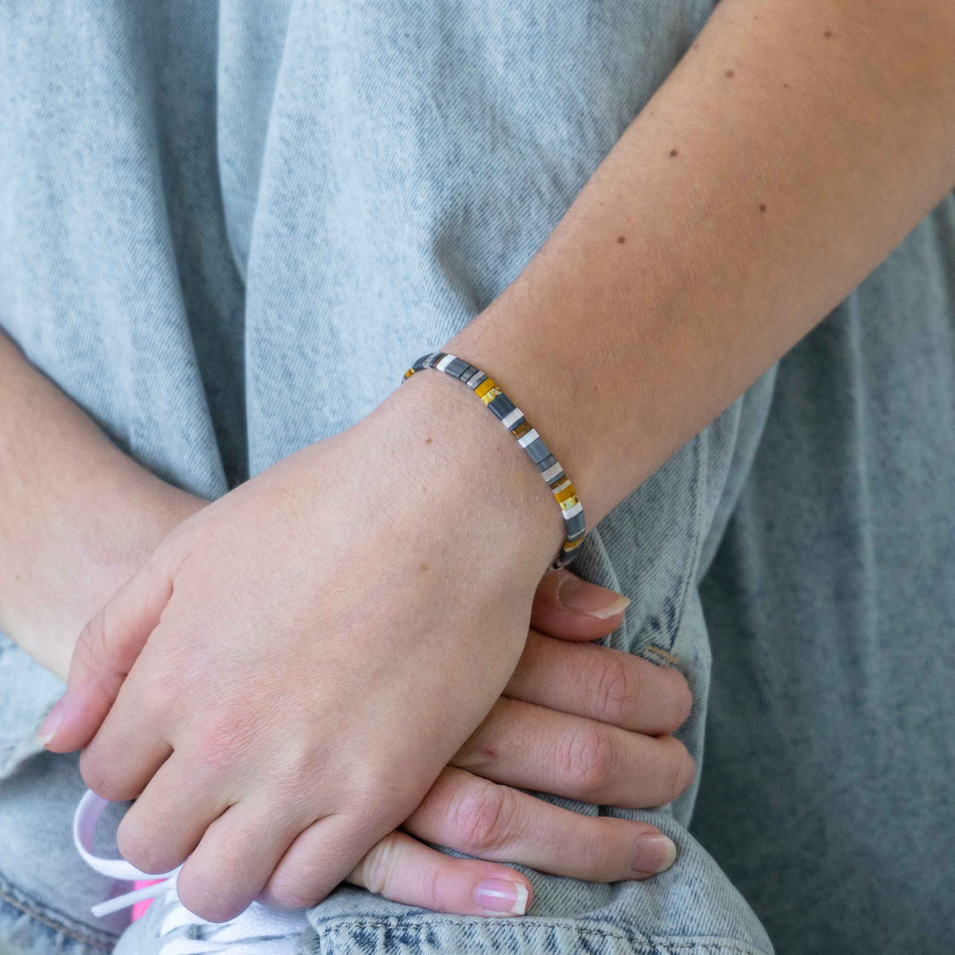 a close up of a person wearing a bracelet