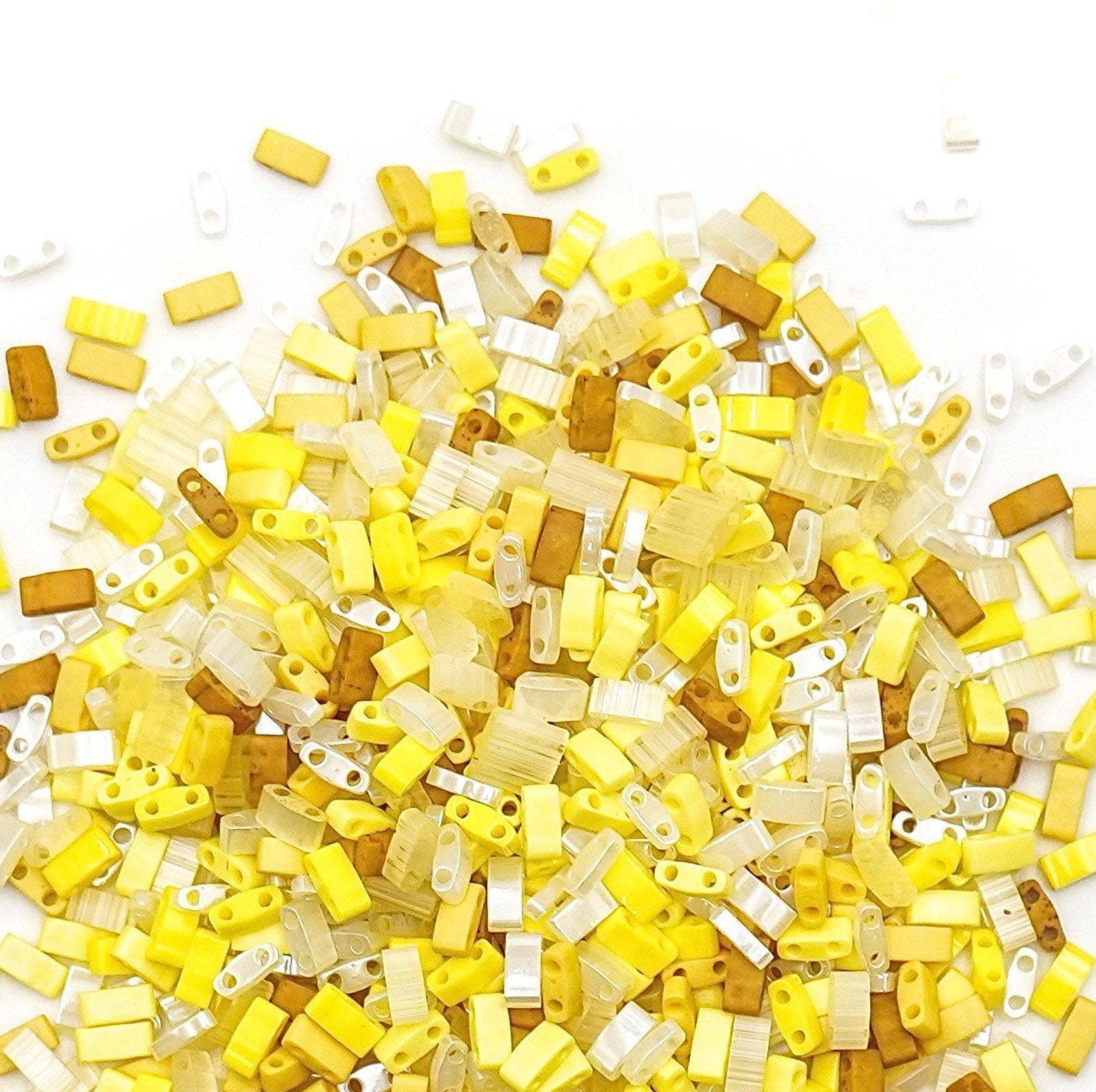 a pile of yellow and white lego pieces