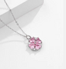 a necklace with a pink flower on it