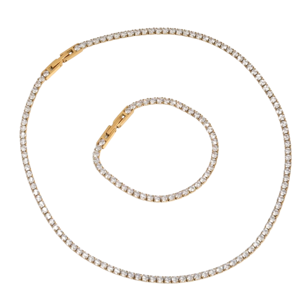 a gold and diamond necklace on a white background