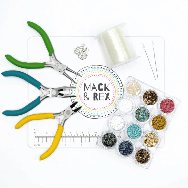 a pair of scissors, a measuring tape, thread, and other crafting supplies