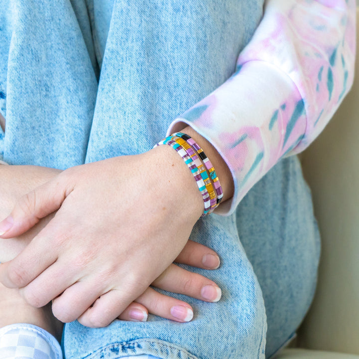 a close up of a person wearing a bracelet