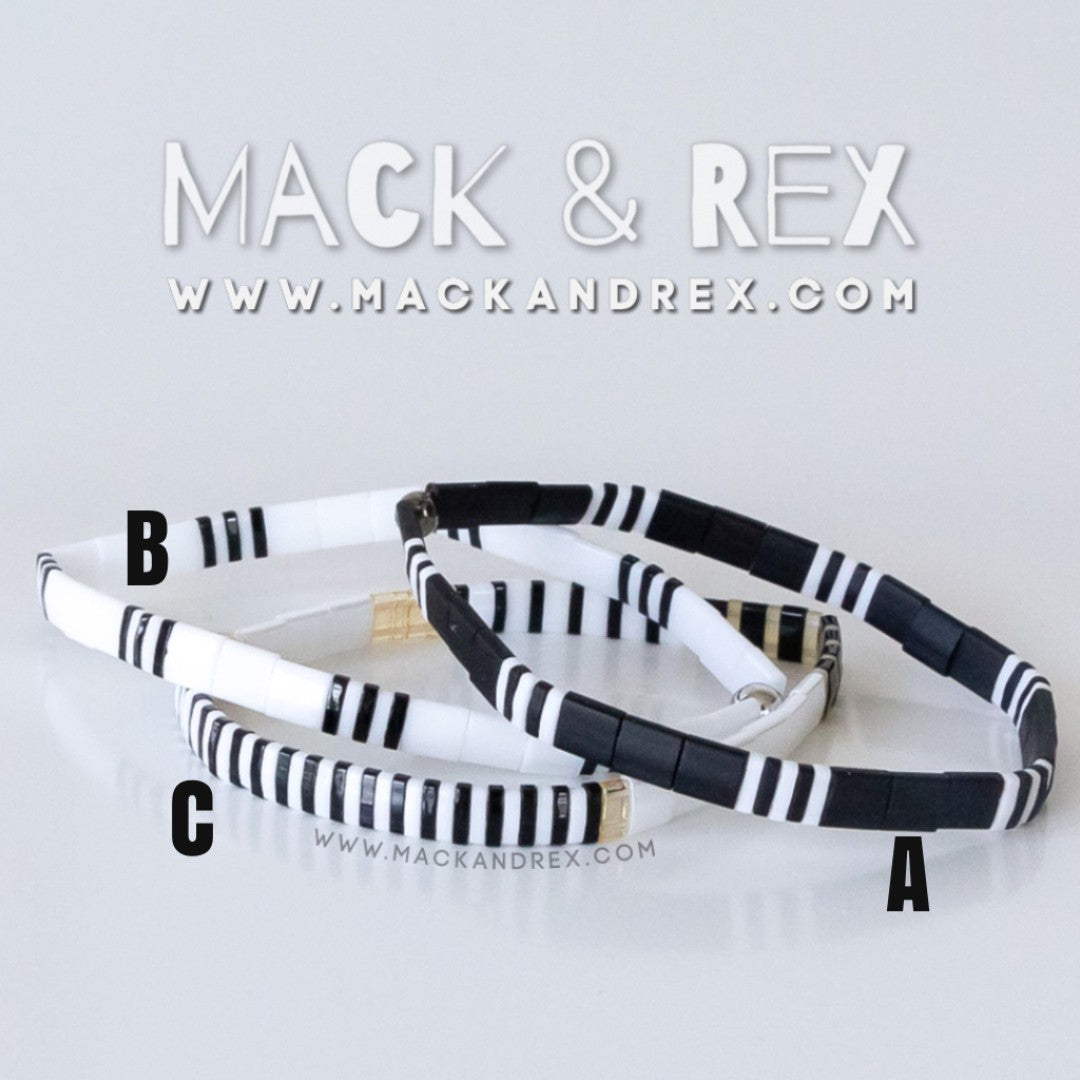 a pair of black and white striped bracelets