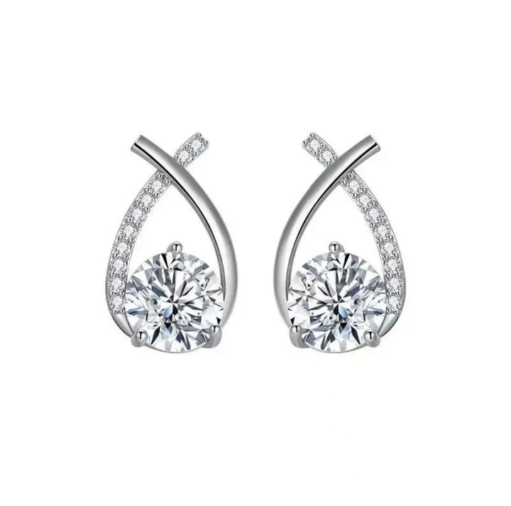 a pair of white gold earrings with diamonds