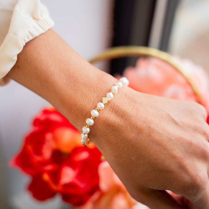 a close up of a person wearing a bracelet