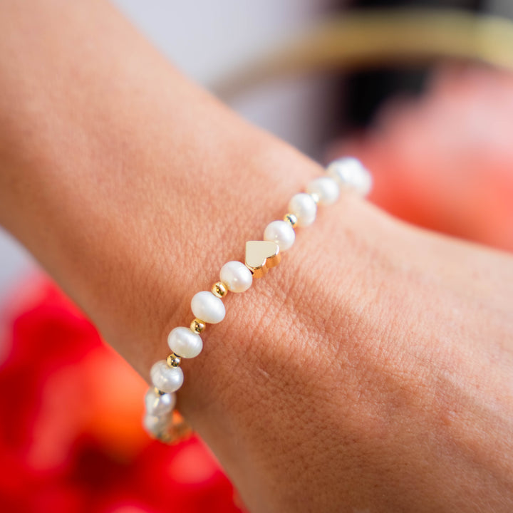 a close up of a person wearing a bracelet