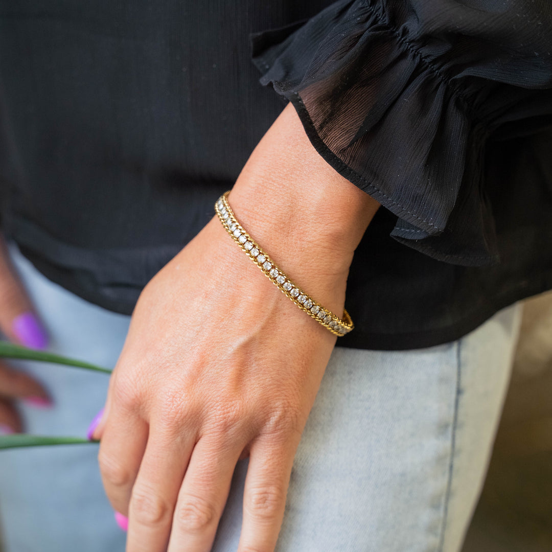 a close up of a person wearing a bracelet