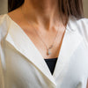 a close up of a woman wearing a white shirt