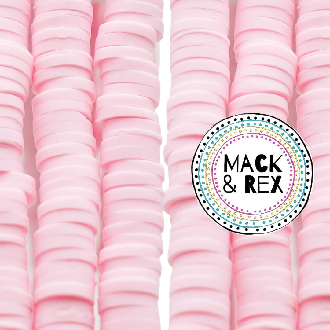 a close up of a pile of pink macaroni and cheese macaroni