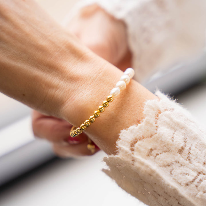 a close up of a person wearing a bracelet