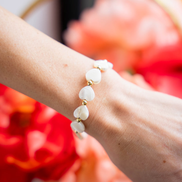 a close up of a person wearing a bracelet