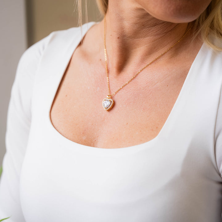 a close up of a woman wearing a necklace