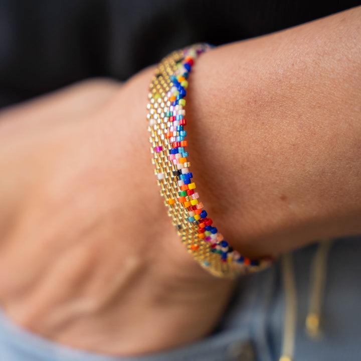 a close up of a person wearing a bracelet