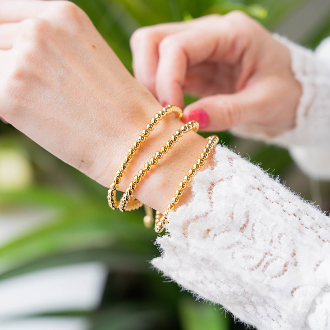 a close up of a person wearing a bracelet