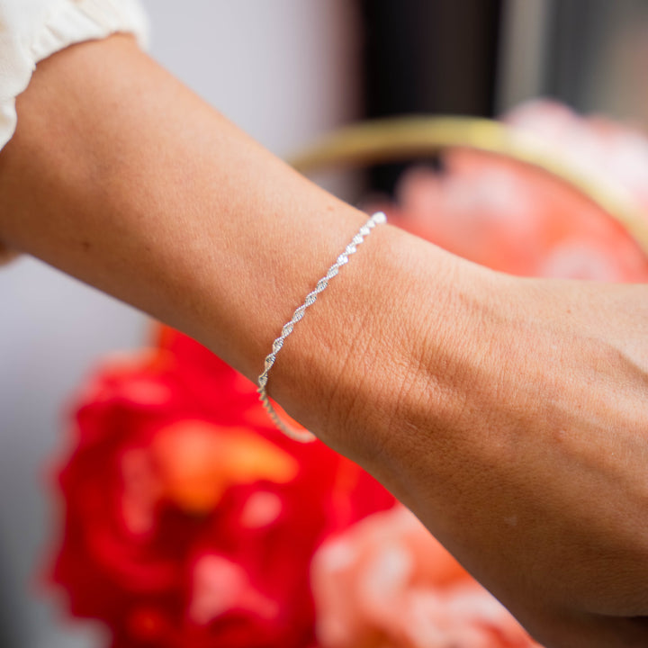 a close up of a person wearing a bracelet