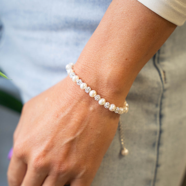 a close up of a person wearing a bracelet