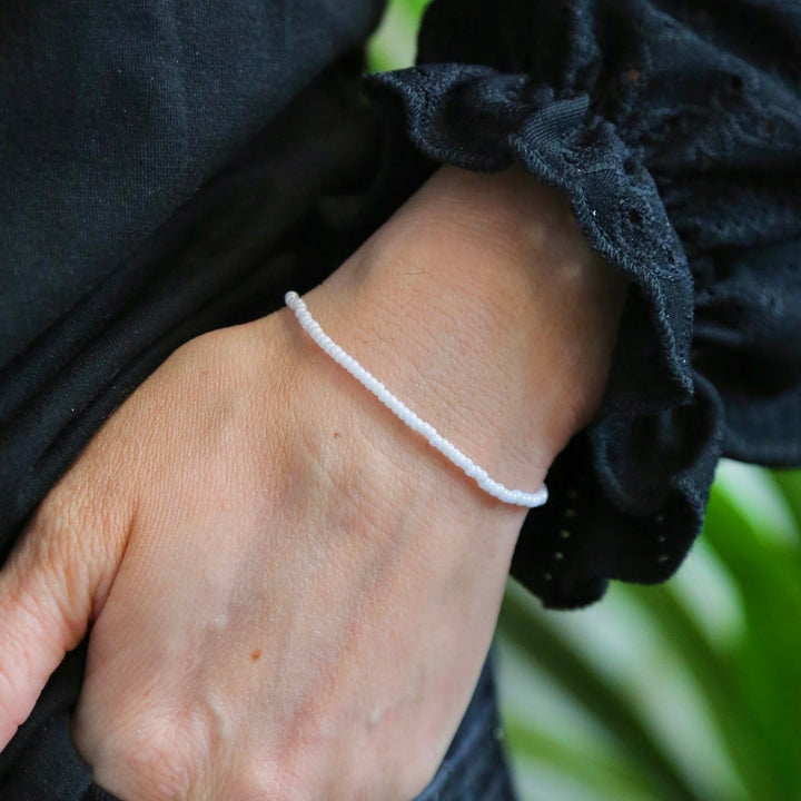 a close up of a person wearing a bracelet