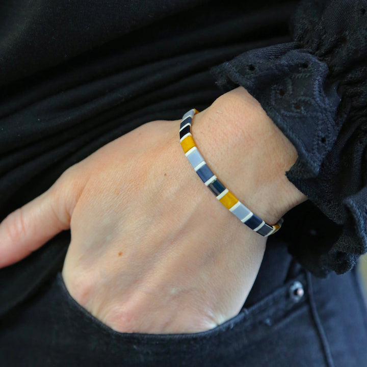 a close up of a person wearing a bracelet