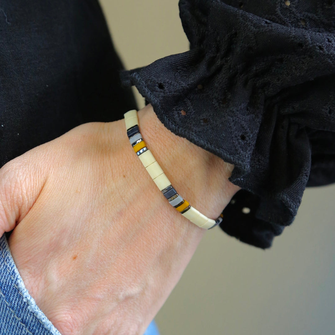 a close up of a person wearing a bracelet