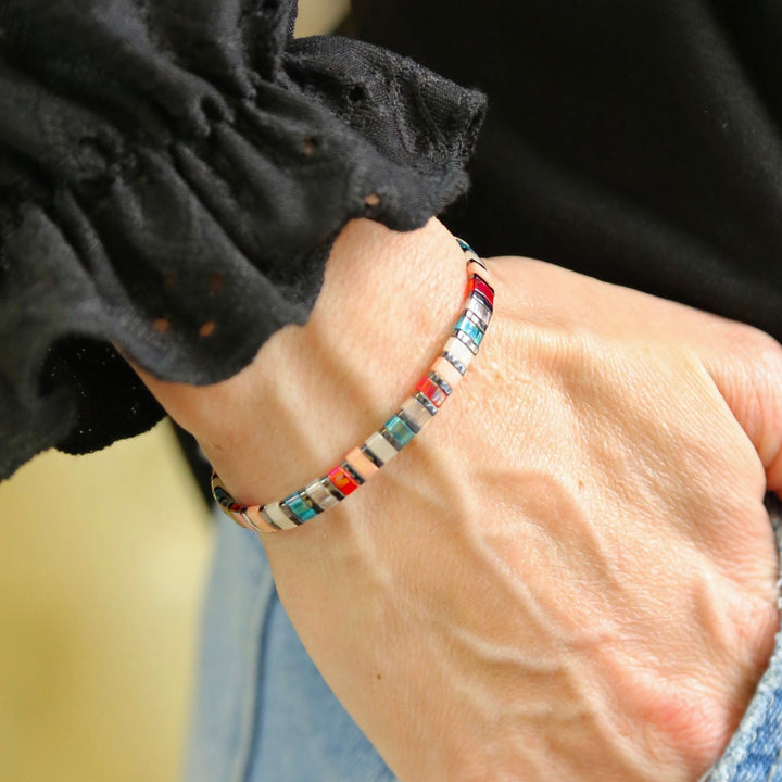 a close up of a person wearing a bracelet