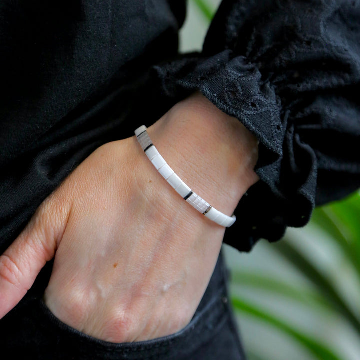 a close up of a person wearing a bracelet